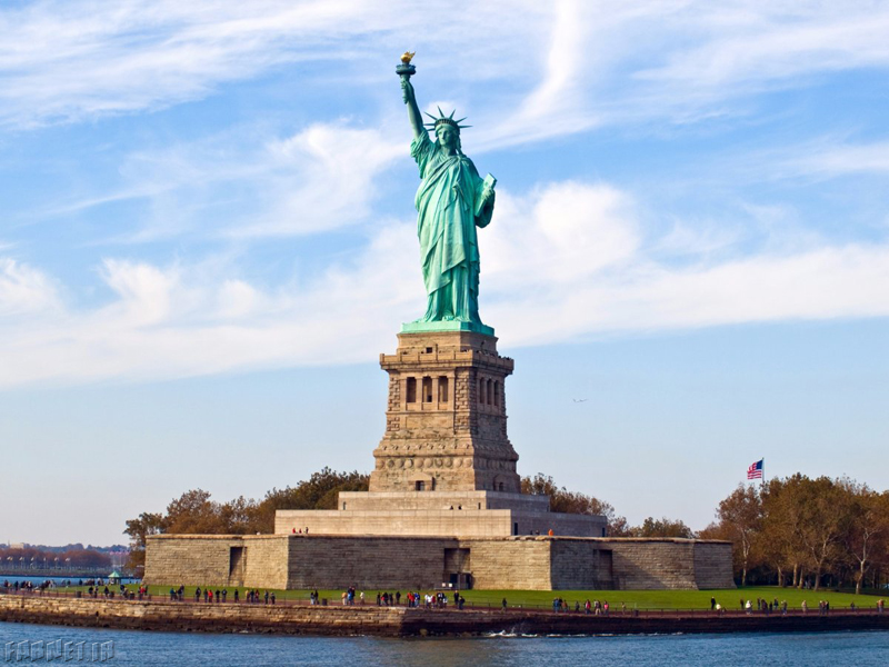 the-statue-of-liberty-stands-high-and-mighty-in-new-york-harbors-liberty-island-the-1510-foot-statue-was-created-in-france-with-giant-steel-supports-before-being-assembled-in-america