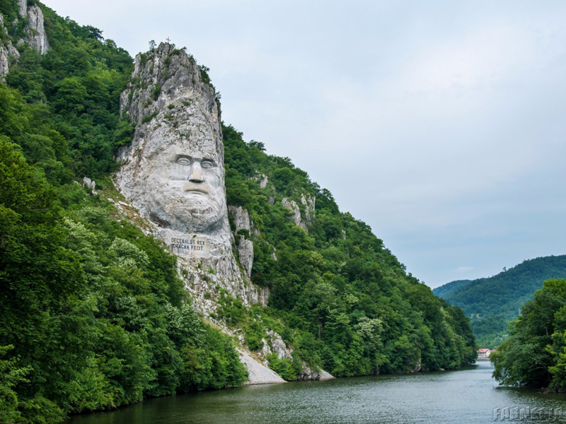 this-rock-sculpture-of-the-face-of-decebalus-dacias-last-king-is-carved-on-a-jagged-outcrop-of-the-danube-river-near-the-city-of-orsova-in-romania-the-131-foot-high-carving-is-the-tallest-rock-sculpture-i